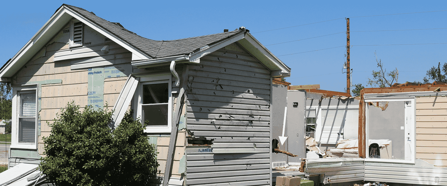 an image from the 2022 andover tornado of a house with no roof