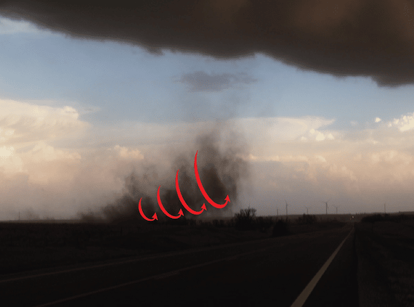 A tornado forming in tipping swirls from the ground up