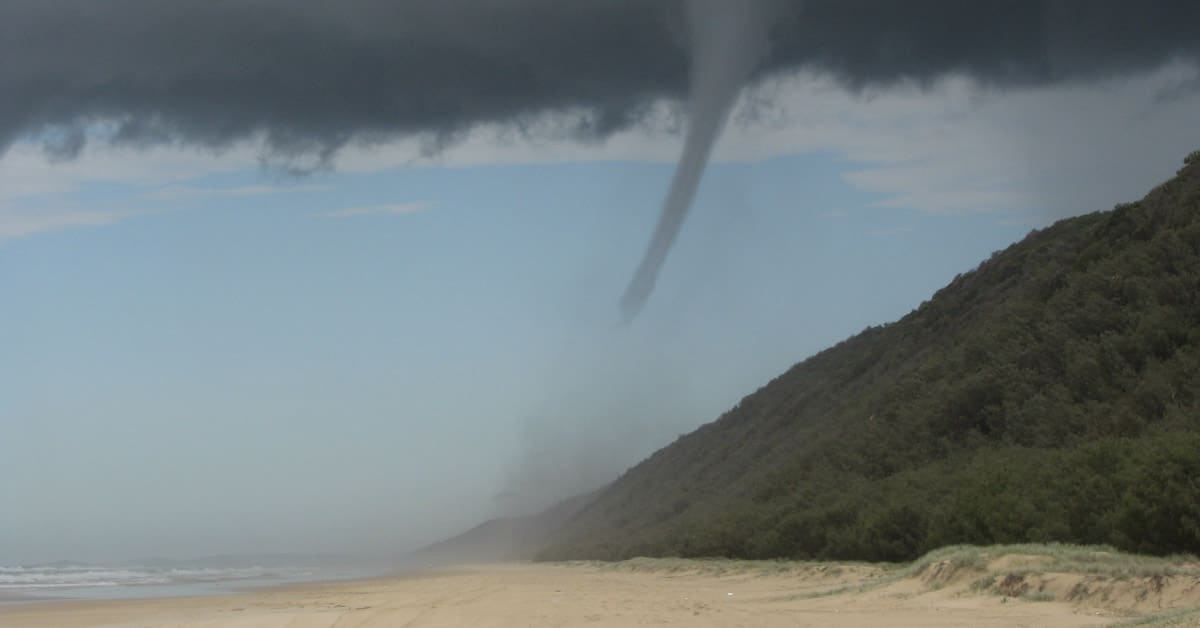 A tornado forming from a hurricane on the coastline