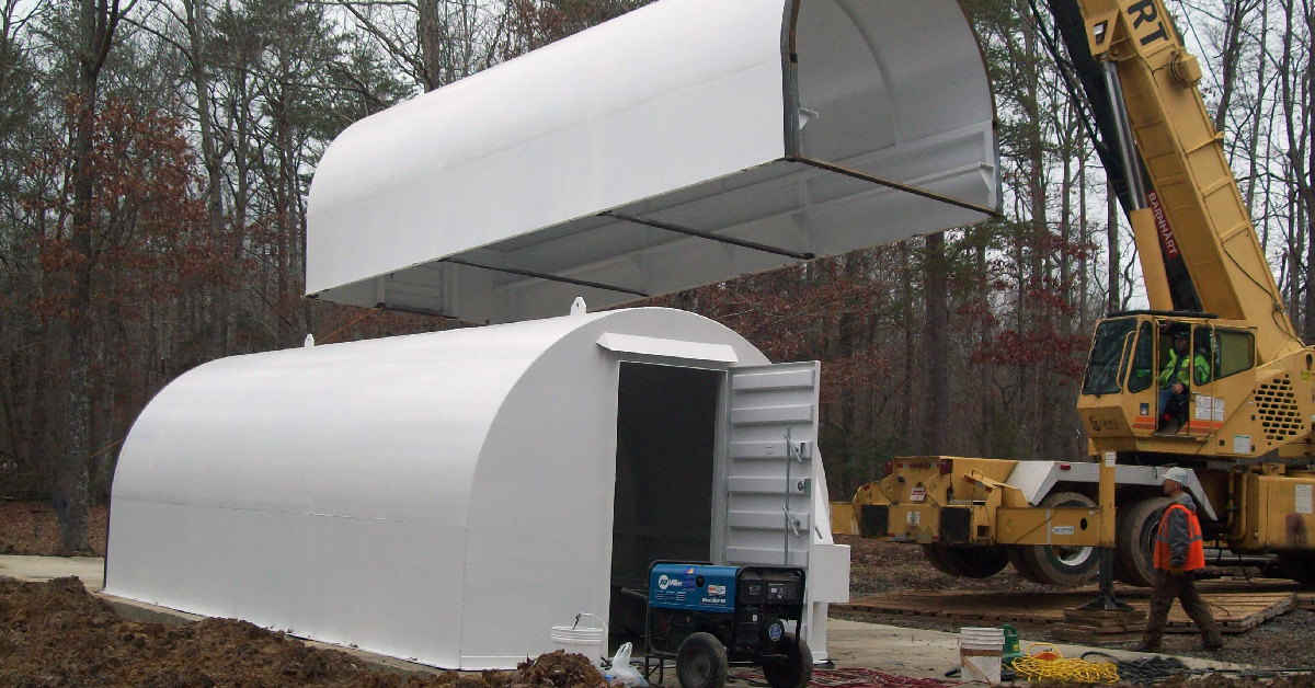 An above-ground commercial tornado shelter being installed.