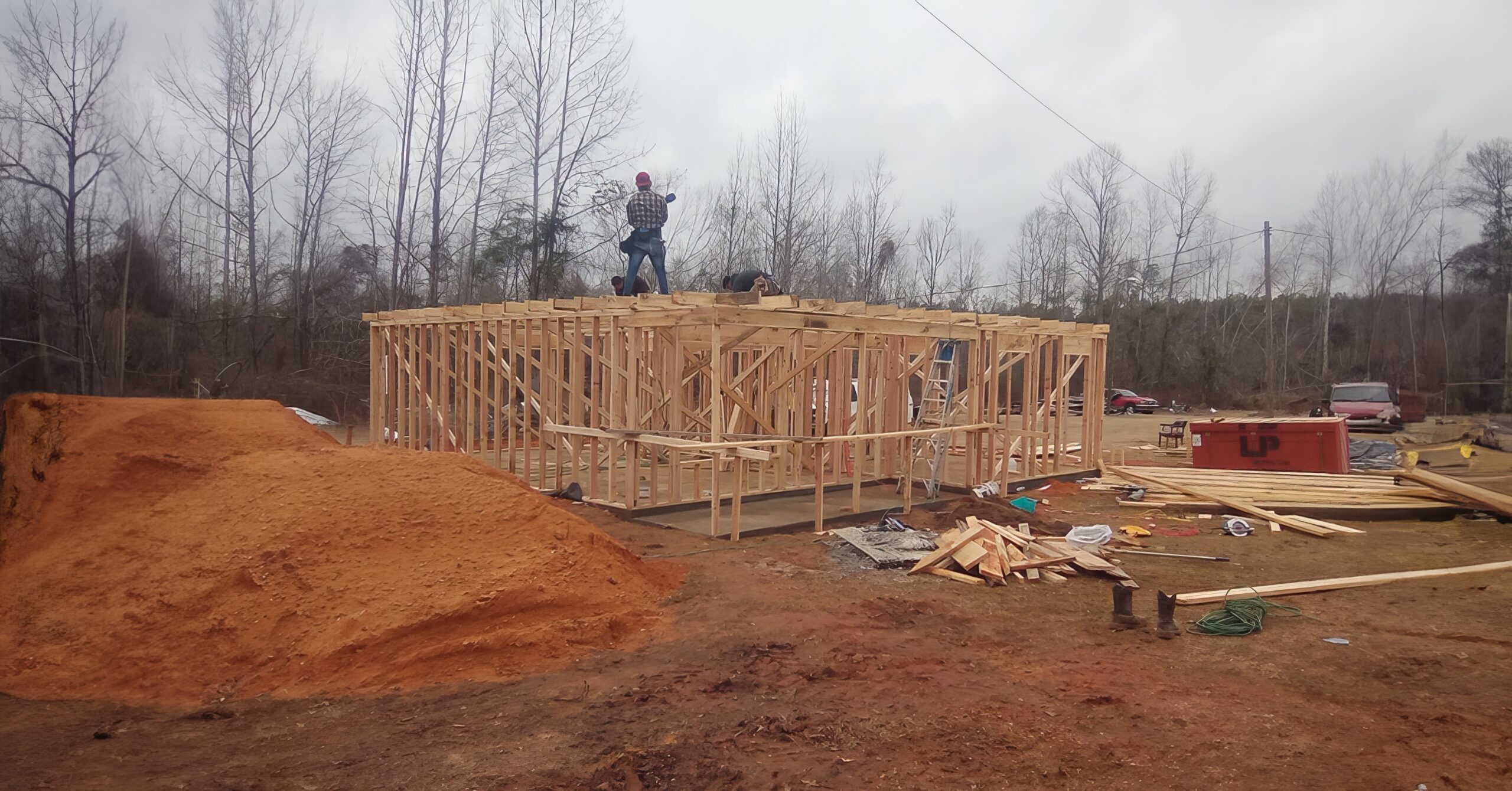 AWFUMC team frames a new house for a storm survivior.