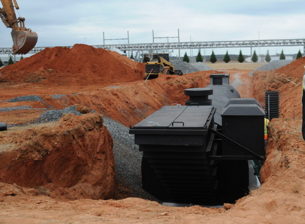 An underground community tornado shelter installation requires extensive excavation measures, as shown here.