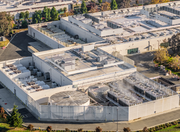 data centers pricing needs Large data center campus with extensive rooftop cooling and mechanical systems.