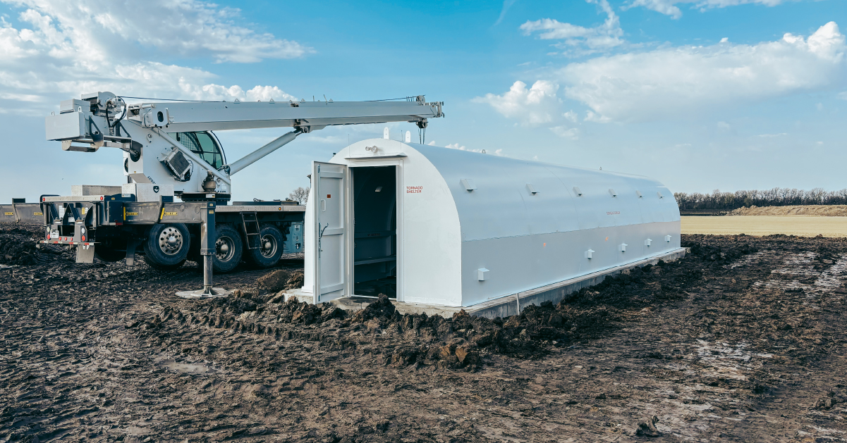 tornado shelter for business Large above-ground tornado shelter for a commercial facility during installation at a construction site.