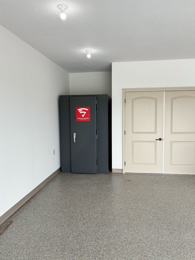 1. Survive-A-Storm residential tornado shelter installed in a garage.